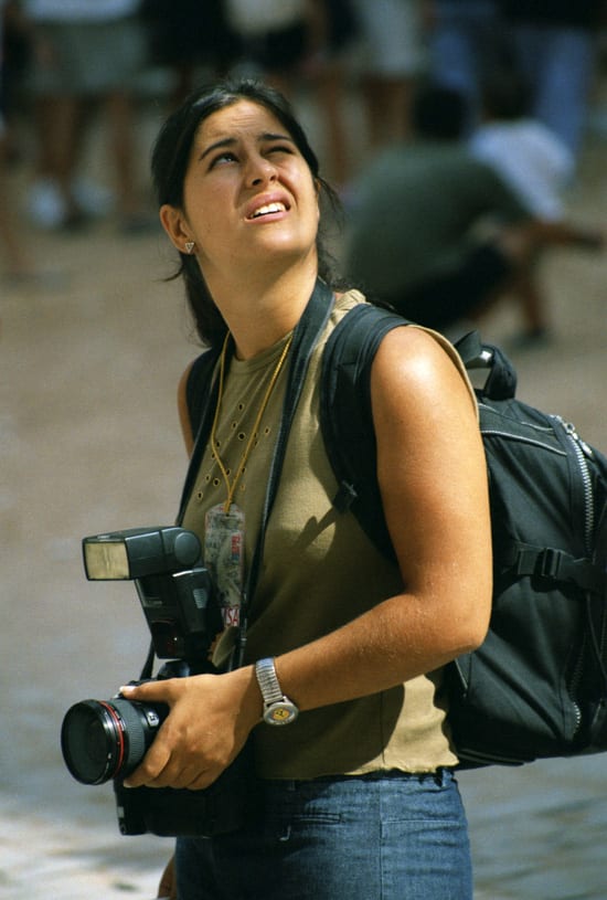 woman looking up with camera